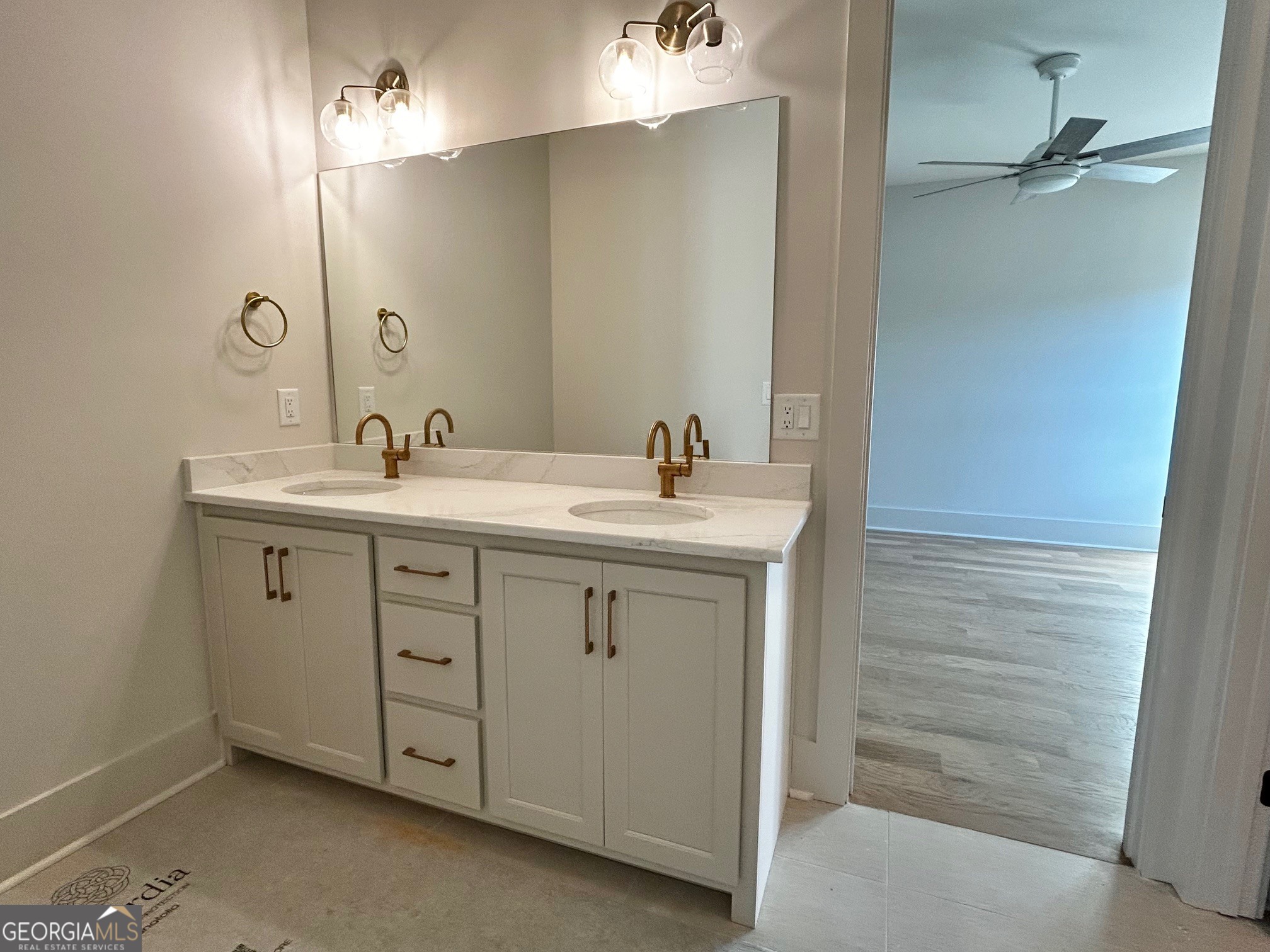 158 Snug Harbor Place Newnan, GA 30263 - Photo 54 of 94 a bathroom with a sink a light fixture a vanity and a mirror