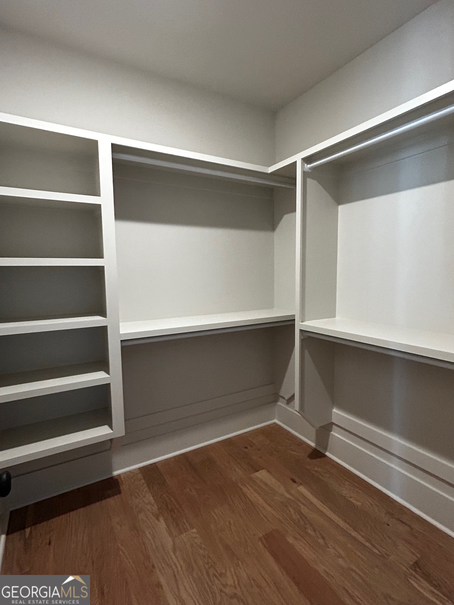 158 Snug Harbor Place Newnan, GA 30263 - Photo 63 of 94 a view of walk in closet with empty racks