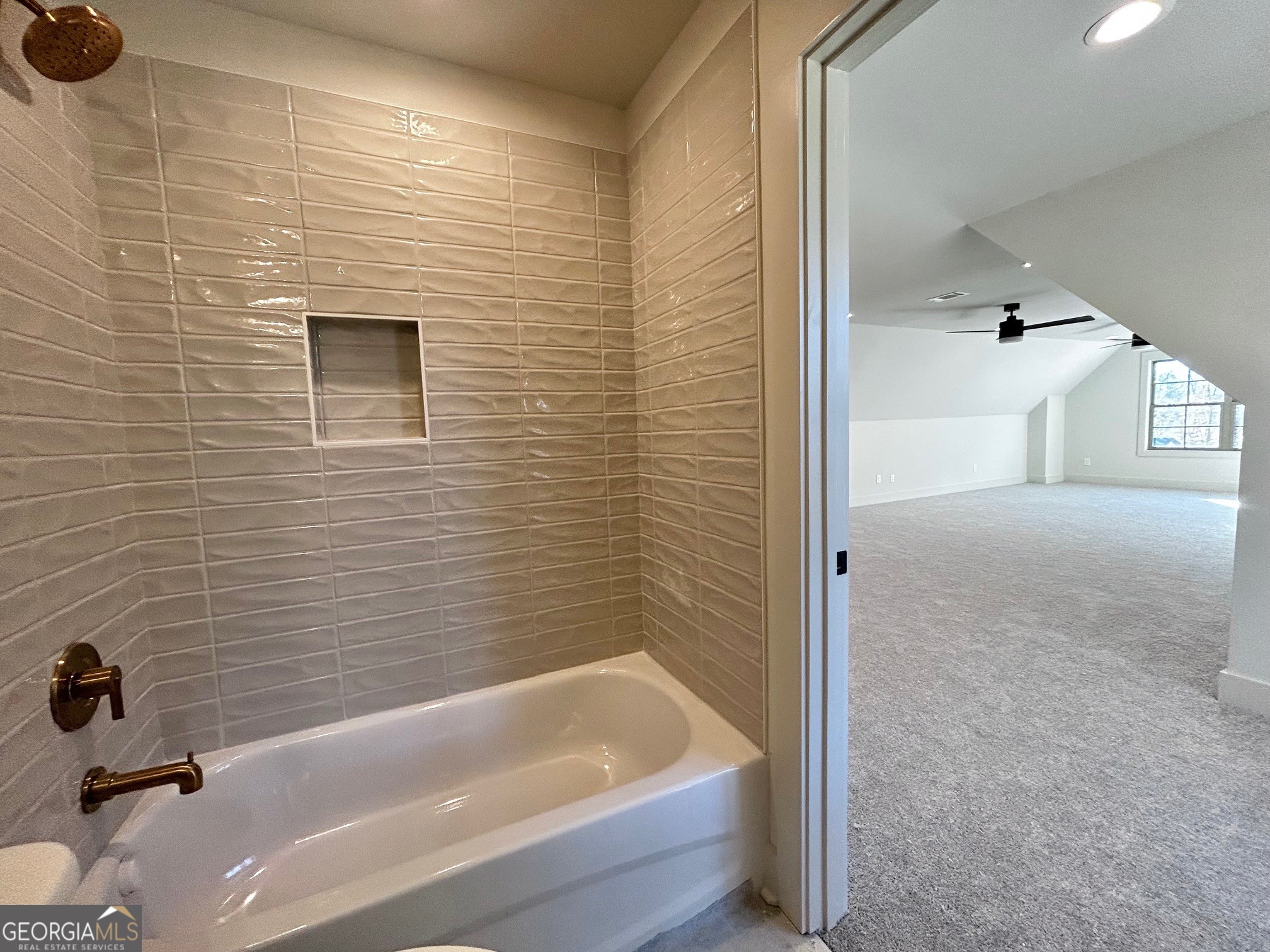 158 Snug Harbor Place Newnan, GA 30263 - Photo 69 of 94 a bathroom with a bathtub and a shower