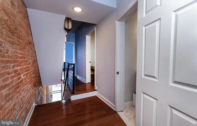 a view of entryway with wooden floor