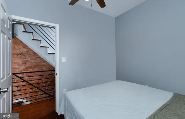a view of staircase with wooden floor