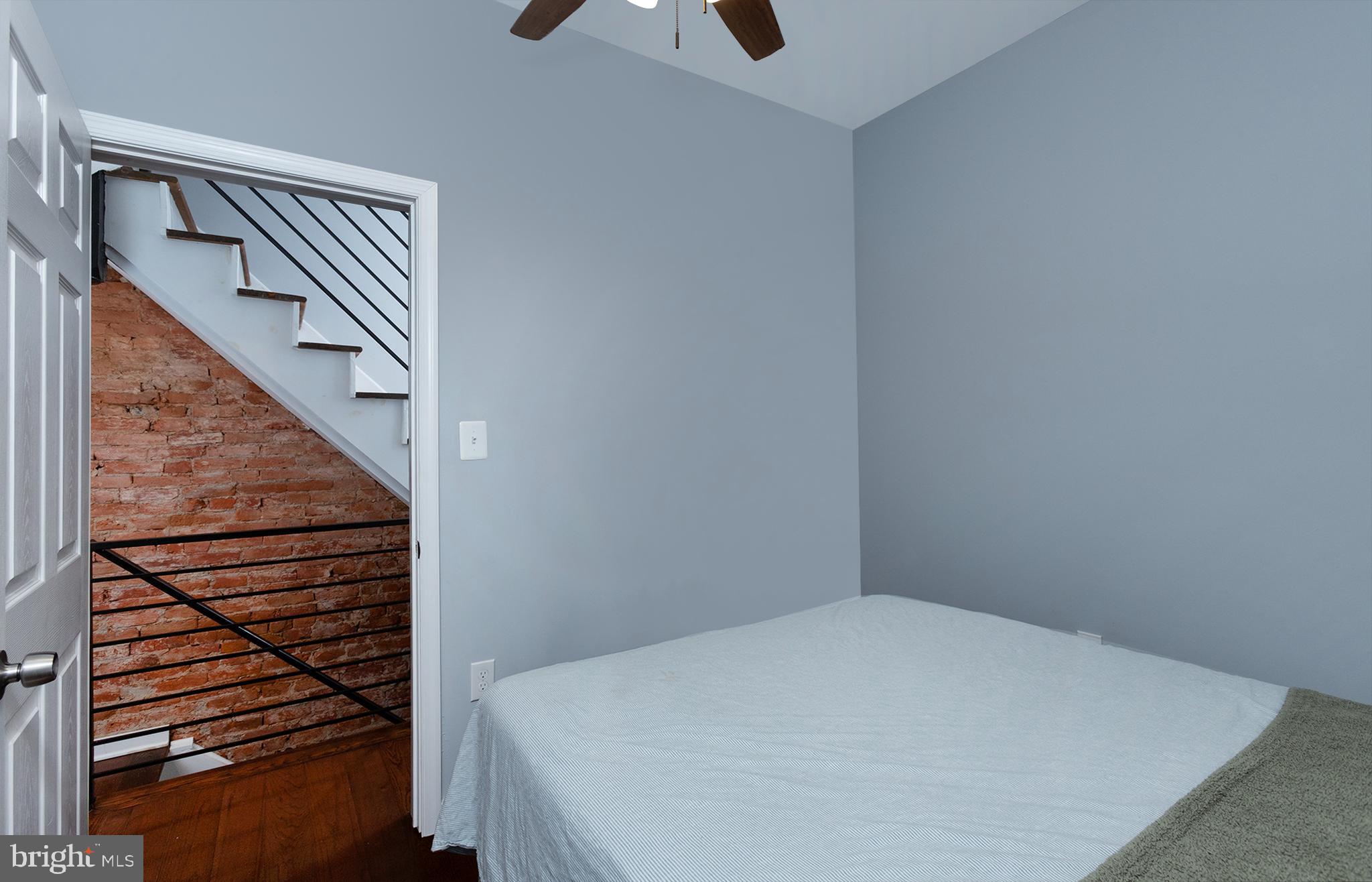 1750 North 25th Street Philadelphia, PA 19121 - Photo 14 of 37 a view of staircase with wooden floor