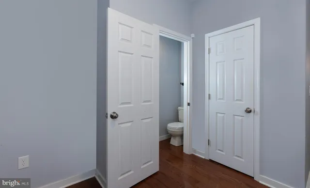 a bathroom view of a toilet and a sink