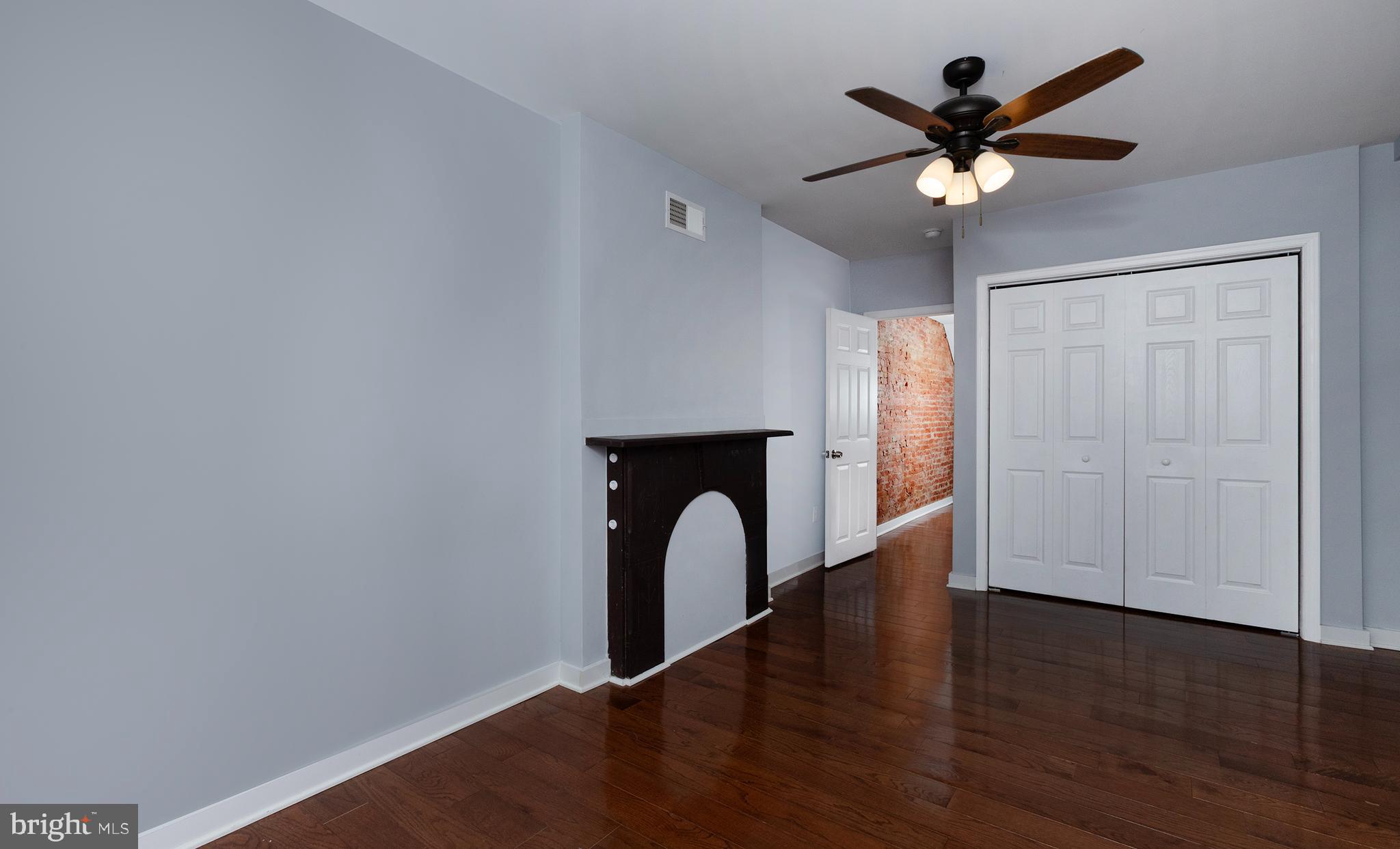 1750 North 25th Street Philadelphia, PA 19121 - Photo 20 of 37 wooden floor in an empty room with a window