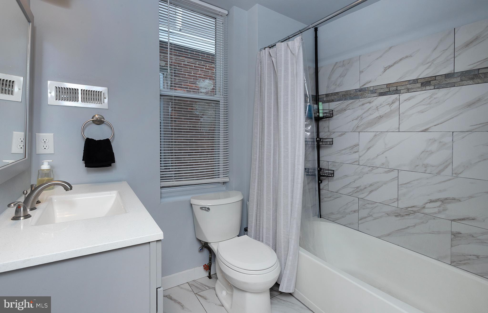 1750 North 25th Street Philadelphia, PA 19121 - Photo 22 of 37 a bathroom with a sink toilet and shower