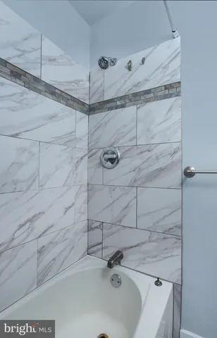 a bathroom with a sink and shower