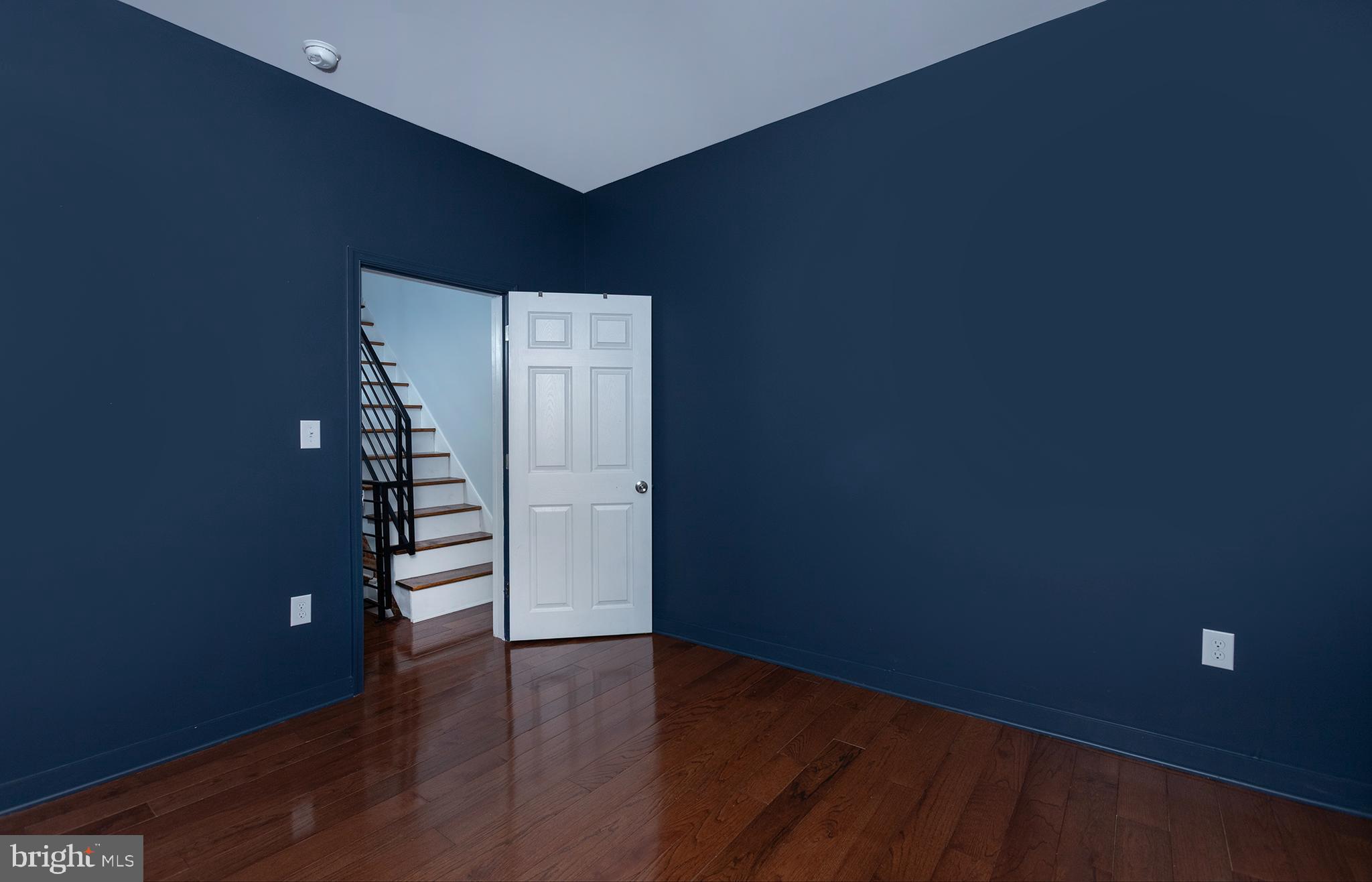 1750 North 25th Street Philadelphia, PA 19121 - Photo 26 of 37 an empty room with wooden floor