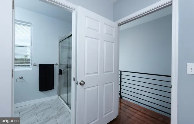 a view of a utility room with closet