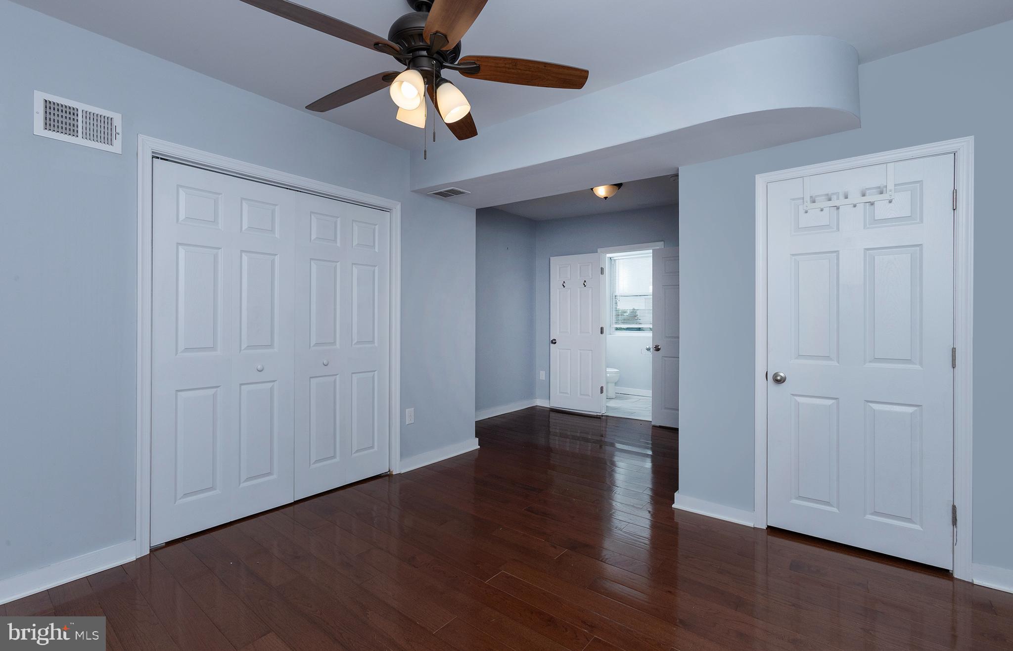 1750 North 25th Street Philadelphia, PA 19121 - Photo 29 of 37 wooden floor in an empty room with a window