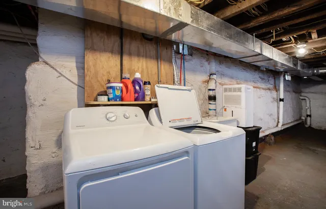 a utility room with dryer and washer