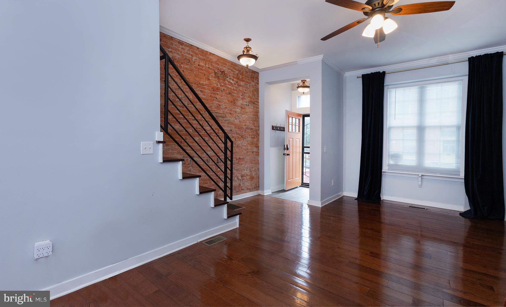 1750 North 25th Street Philadelphia, PA 19121 - Photo 4 of 37 wooden floor in an empty room with a window