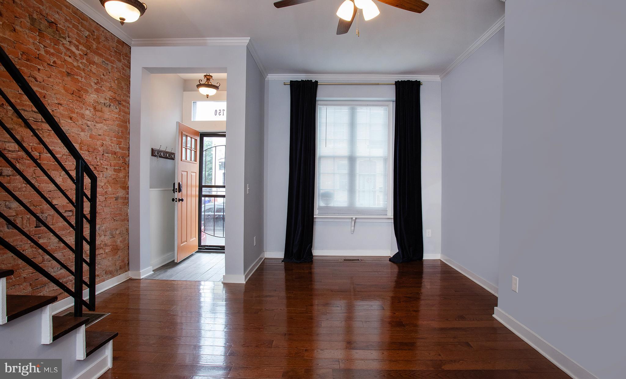 1750 North 25th Street Philadelphia, PA 19121 - Photo 5 of 37 a view of an entryway with wooden floor and a window