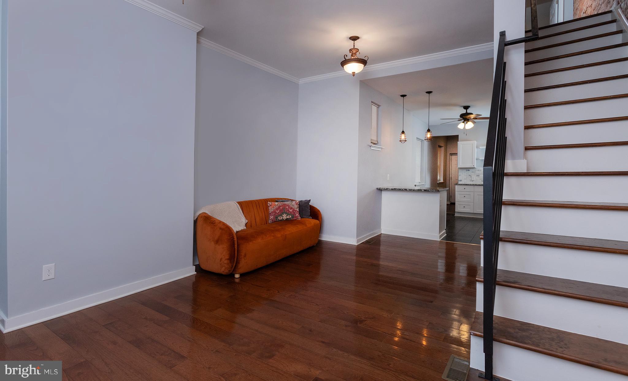 1750 North 25th Street Philadelphia, PA 19121 - Photo 6 of 37 a living room with furniture and a wooden floor