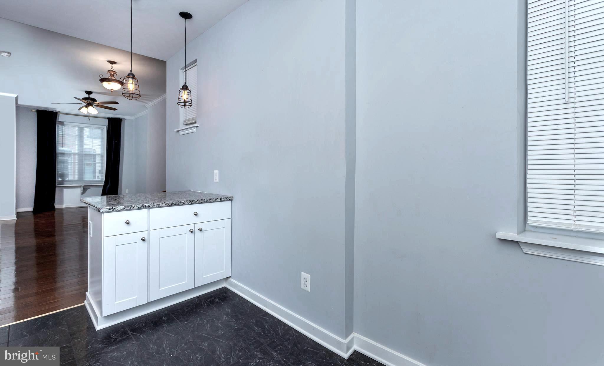 1750 North 25th Street Philadelphia, PA 19121 - Photo 7 of 37 a view of a hallway with chandelier