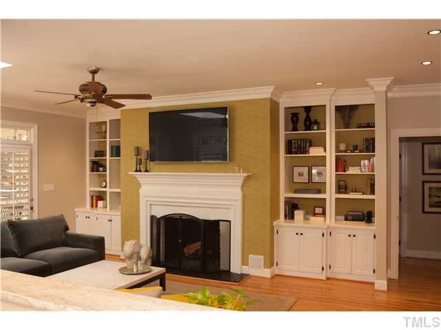 3928 Westchester Road Durham, NC 27707 - Photo 3 of 21 Family room has a wall of large windows. Watch the seasons change. Gas fireplace with built-ins on either side.