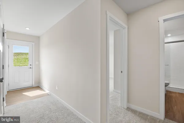 a view of hallway with livingroom