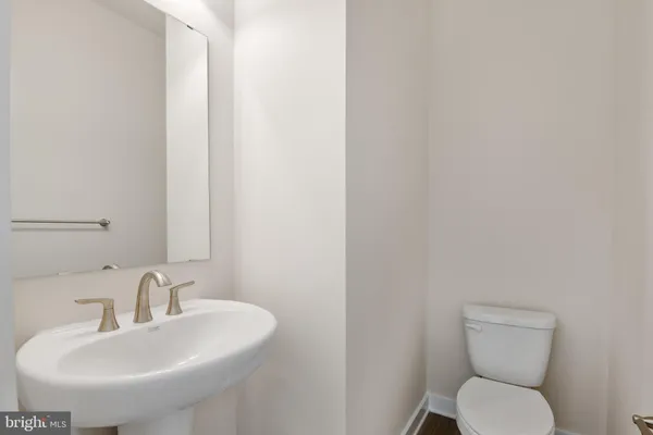 a bathroom with a toilet and sink