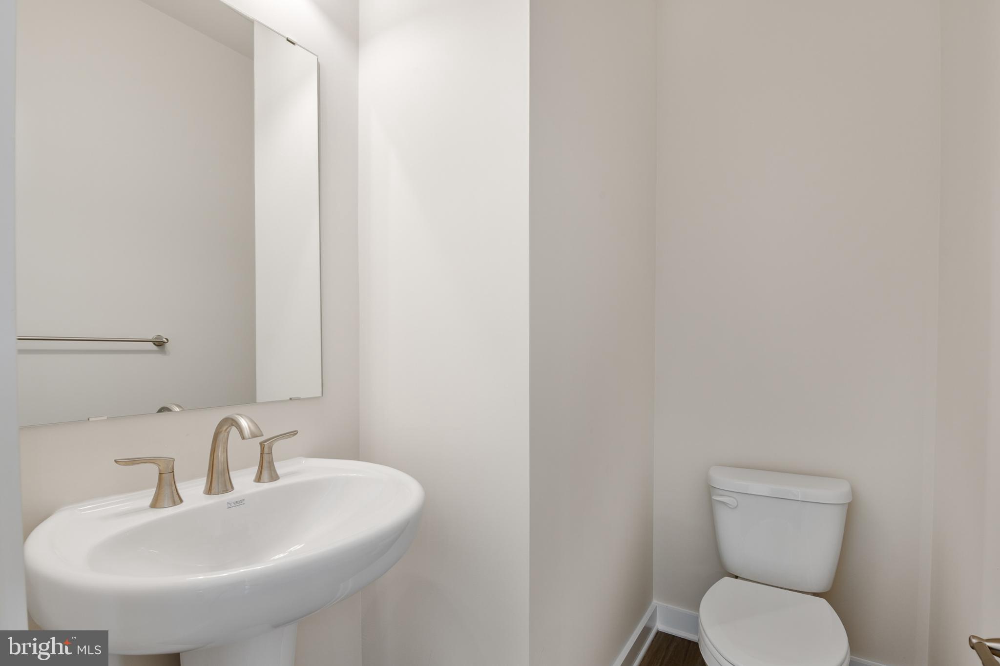 21 Lyriq Court Inwood, WV 25428 - Photo 16 of 40 a bathroom with a toilet and sink