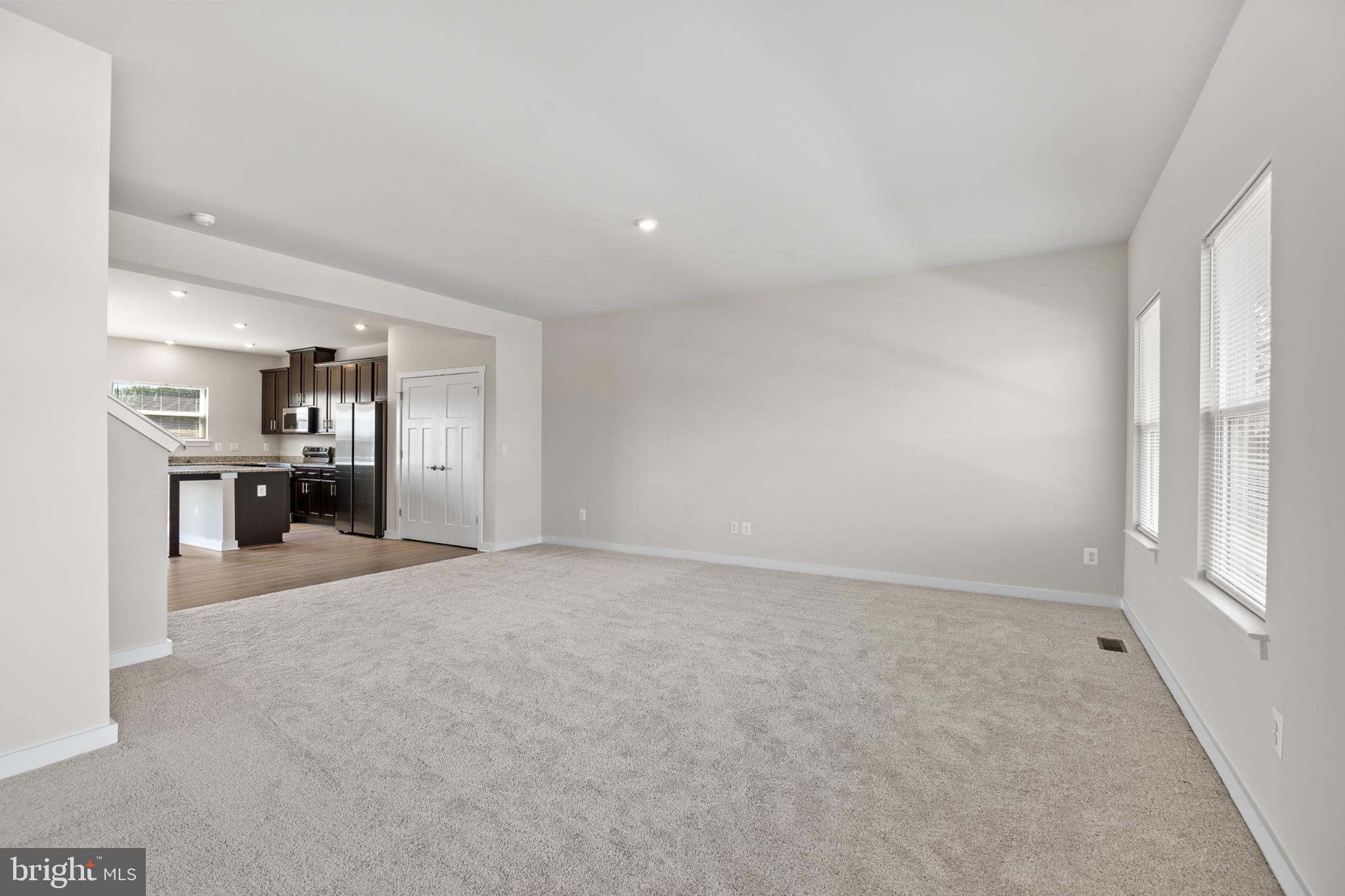 21 Lyriq Court Inwood, WV 25428 - Photo 17 of 40 a view of empty room with kitchen