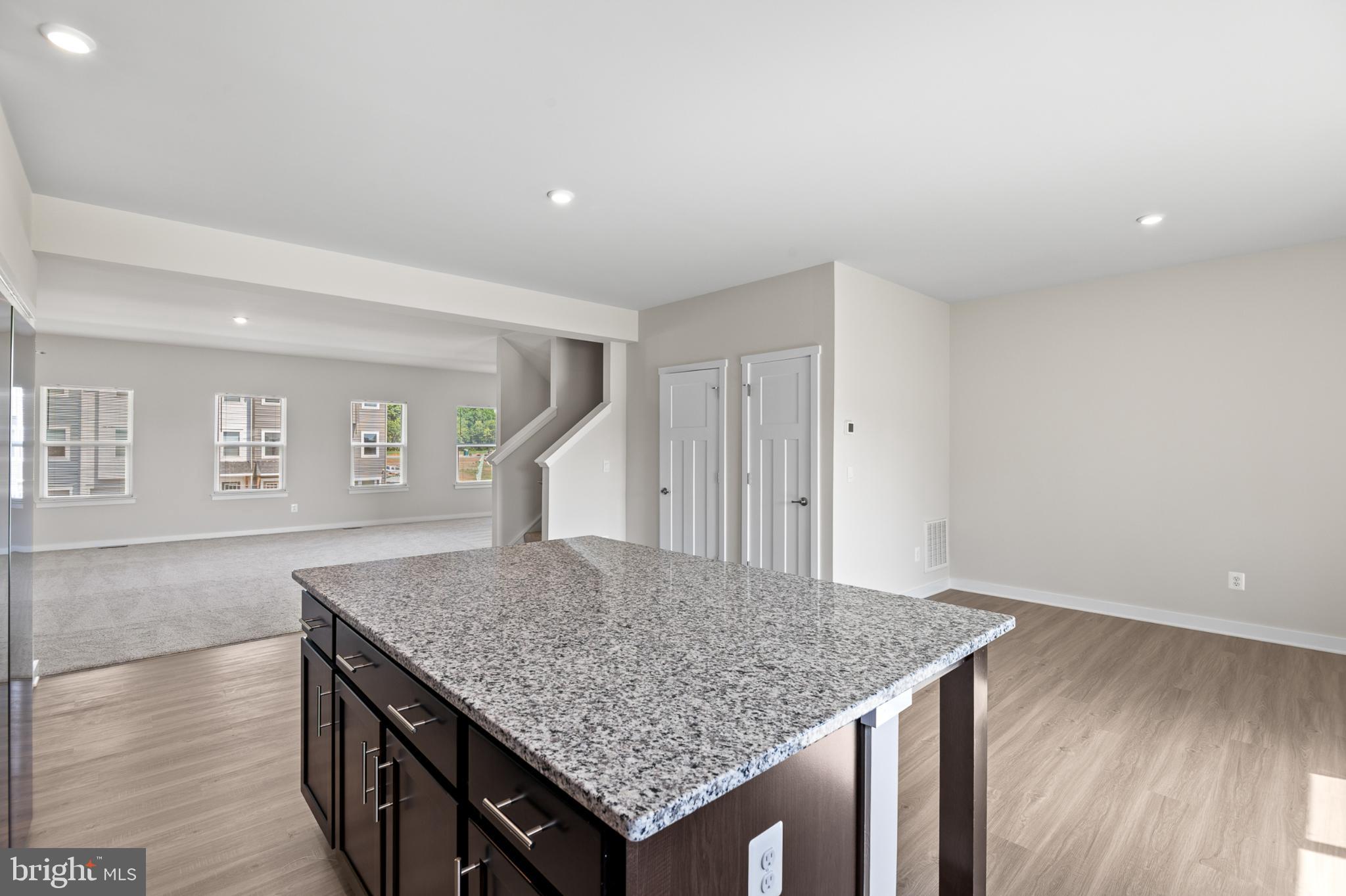 21 Lyriq Court Inwood, WV 25428 - Photo 24 of 40 wooden floor in an empty room with a window
