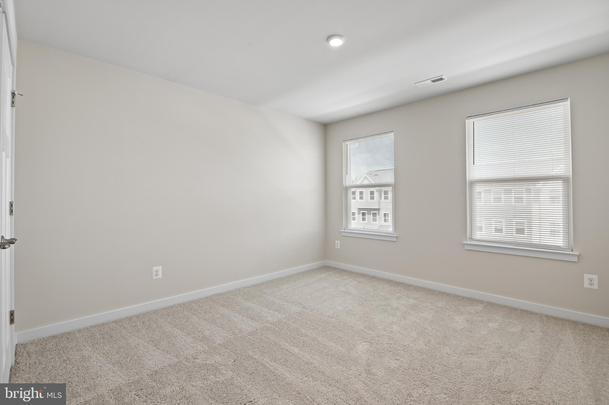 21 Lyriq Court Inwood, WV 25428 - Photo 29 of 40 an empty room with windows