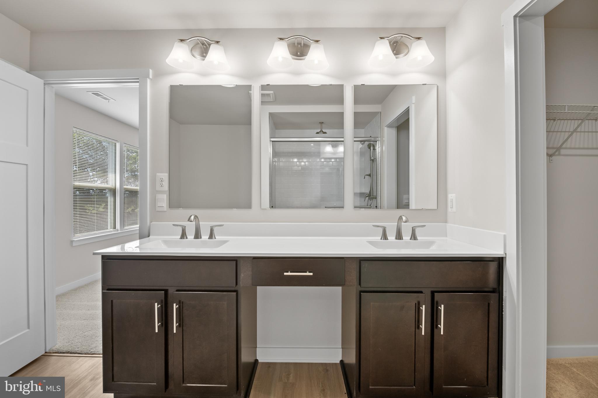 21 Lyriq Court Inwood, WV 25428 - Photo 36 of 40 a bathroom with a sink and a mirror