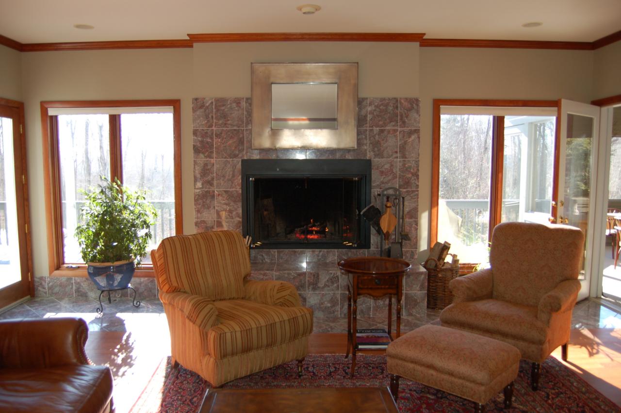 275 Hupi Road Monterey, MA 01245 - Photo 17 of 40 a living room with furniture and a fireplace
