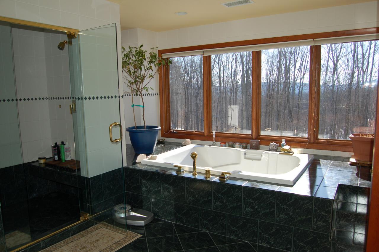 275 Hupi Road Monterey, MA 01245 - Photo 24 of 40 a bathroom with a granite countertop sink and a bathtub