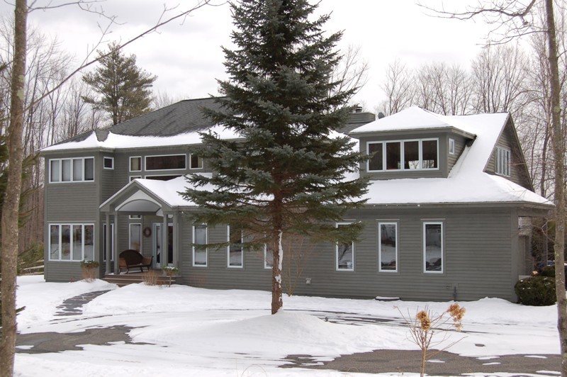 275 Hupi Road Monterey, MA 01245 - Photo 4 of 40 a front view of a house with a yard
