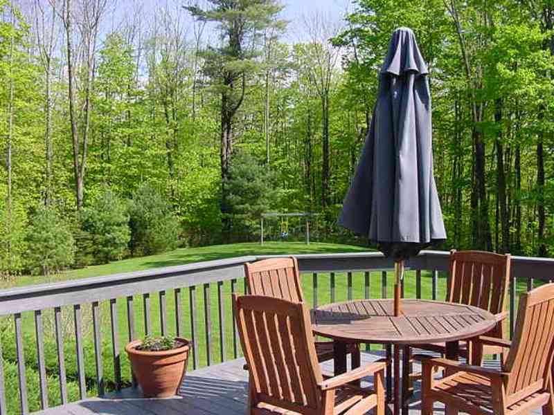 275 Hupi Road Monterey, MA 01245 - Photo 34 of 40 a view of a two chairs and table in the balcony