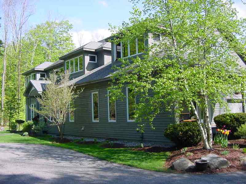 275 Hupi Road Monterey, MA 01245 - Photo 38 of 40 a front view of a house with a yard