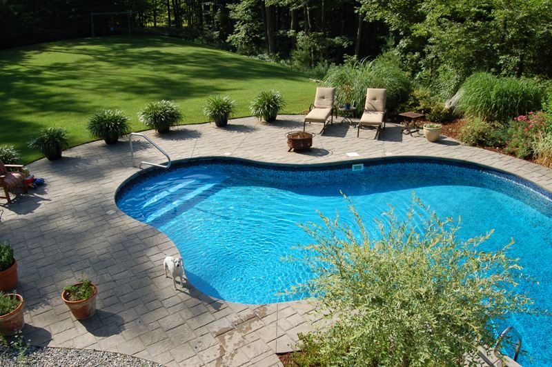 275 Hupi Road Monterey, MA 01245 - Photo 8 of 40 a view of a backyard with table and chairs plants and large trees