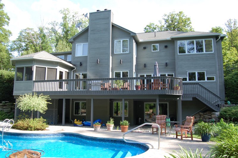 275 Hupi Road Monterey, MA 01245 - Photo 9 of 40 a front view of a house with swimming pool