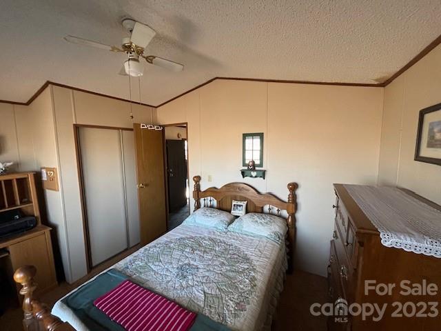 2508 Stack Road Monroe, NC 28112 - Photo 33 of 36 a bedroom with a bed and a chandelier