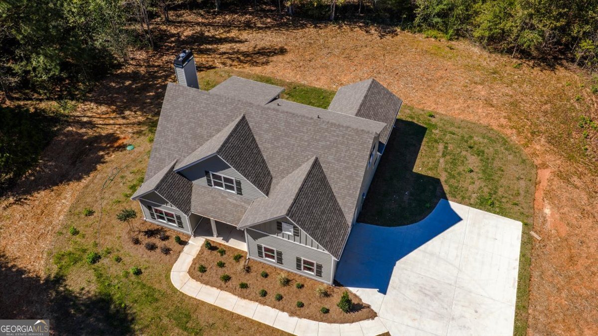 1570 The Rock Road Thomaston, GA 30286 - Photo 5 of 53 an aerial view of a house with table and chairs