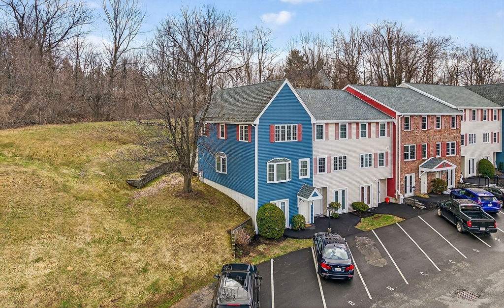 a front view of a house with parking area
