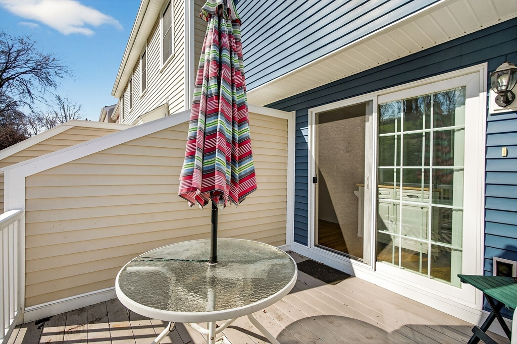 61 Fox Meadow Road, Unit A Leominster, MA 01453 - Photo 11 of 38 a balcony with table and chairs