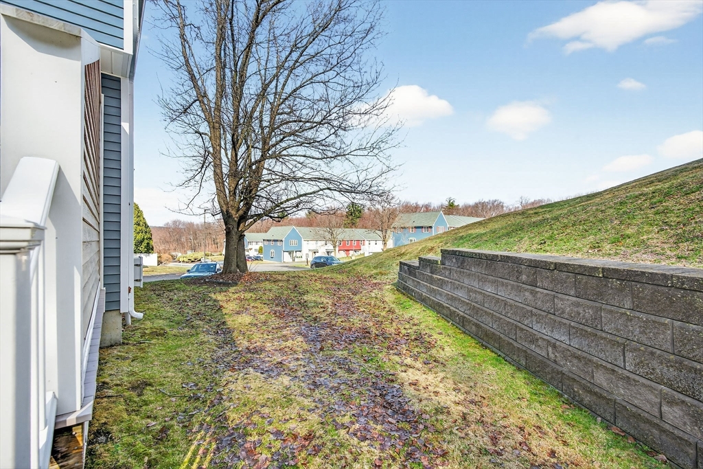 61 Fox Meadow Road, Unit A Leominster, MA 01453 - Photo 12 of 38 a view of a yard with an trees