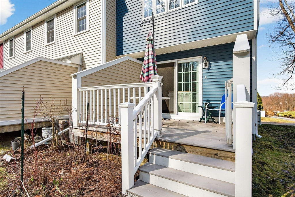 61 Fox Meadow Road, Unit A Leominster, MA 01453 - Photo 13 of 38 a view of small house with backyard and porch