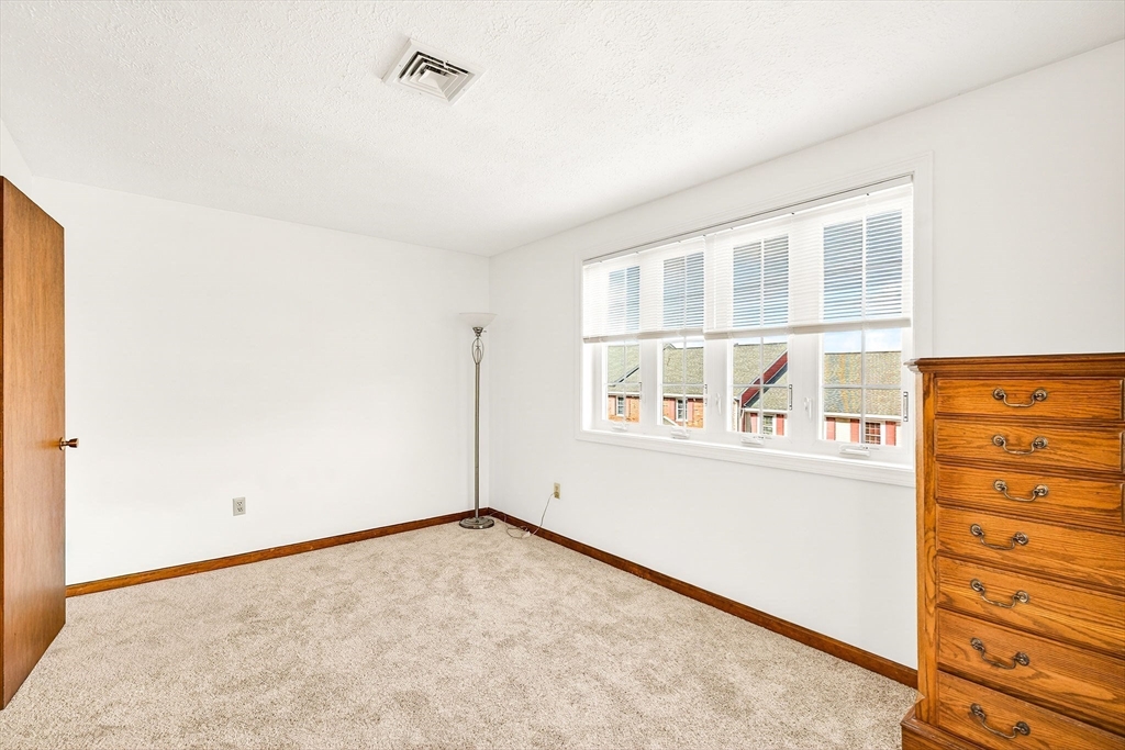 61 Fox Meadow Road, Unit A Leominster, MA 01453 - Photo 16 of 38 an empty room with a window