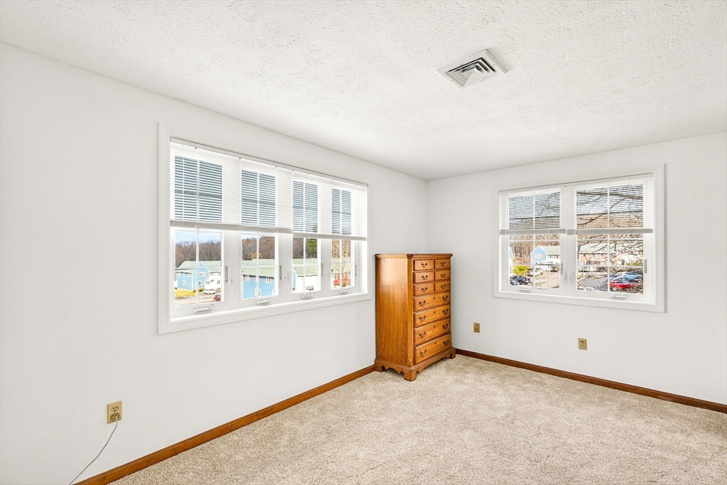 61 Fox Meadow Road, Unit A Leominster, MA 01453 - Photo 18 of 38 an empty room with windows