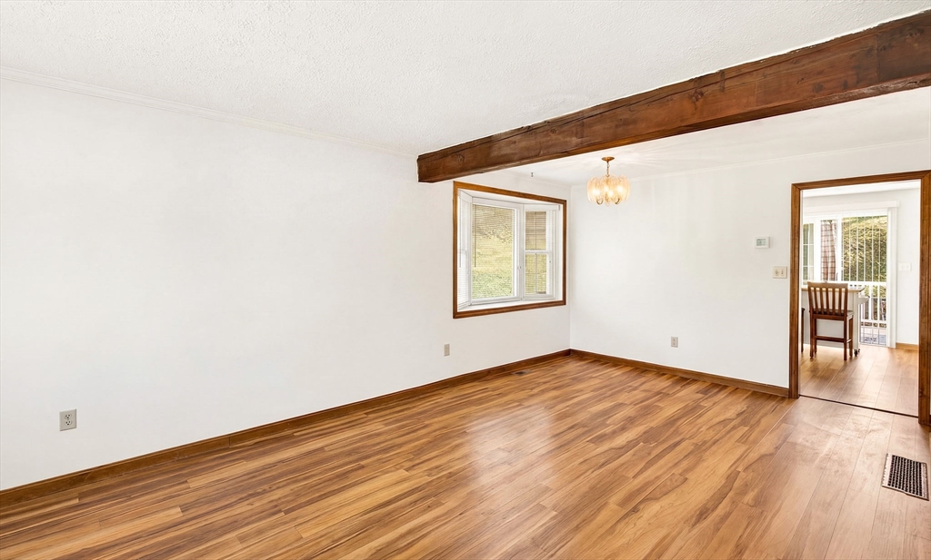 61 Fox Meadow Road, Unit A Leominster, MA 01453 - Photo 2 of 38 an empty room with wooden floor and windows