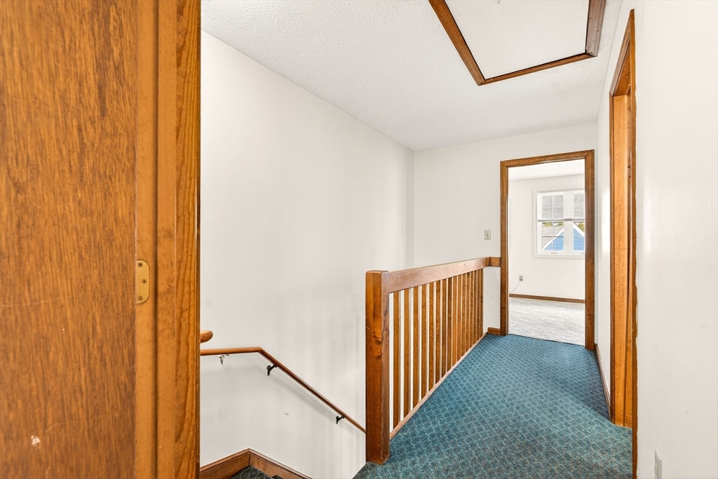 61 Fox Meadow Road, Unit A Leominster, MA 01453 - Photo 23 of 38 a view of a hallway with a hallway