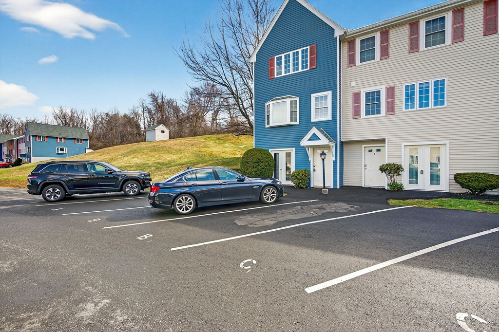 61 Fox Meadow Road, Unit A Leominster, MA 01453 - Photo 30 of 38 a view of a cars park in front of a building