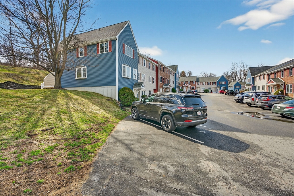 61 Fox Meadow Road, Unit A Leominster, MA 01453 - Photo 31 of 38 a car parked in front of a building