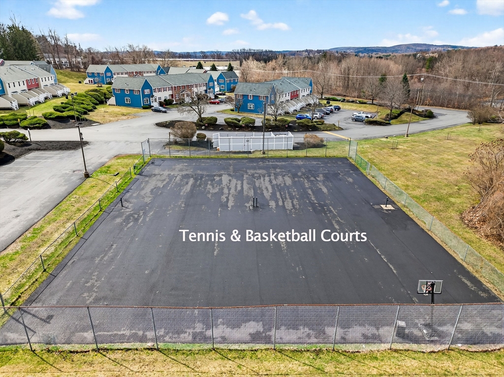 61 Fox Meadow Road, Unit A Leominster, MA 01453 - Photo 37 of 38 a view of a swimming pool with outdoor seating