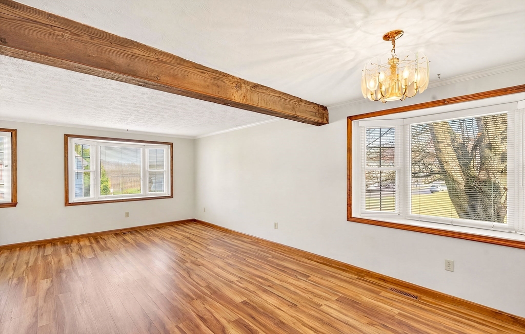 61 Fox Meadow Road, Unit A Leominster, MA 01453 - Photo 4 of 38 a view of an empty room with wooden floor and a window