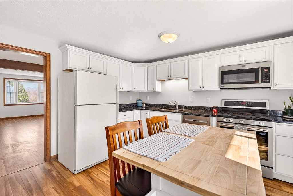 61 Fox Meadow Road, Unit A Leominster, MA 01453 - Photo 6 of 38 a kitchen with stainless steel appliances a stove refrigerator sink and microwave