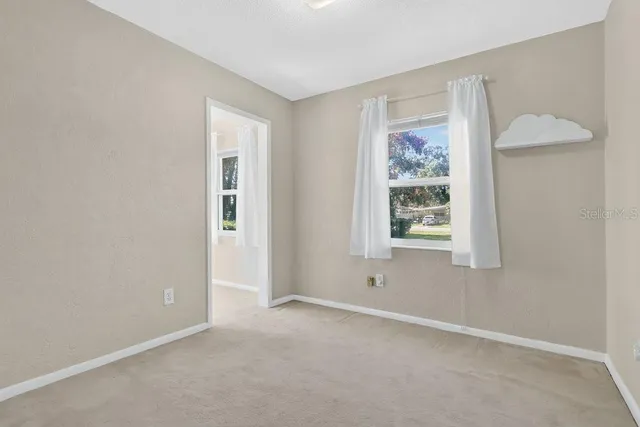 an empty room with windows