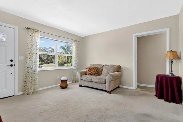 a living room with furniture and a window